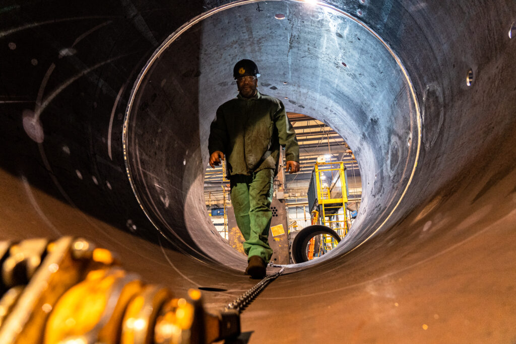 Burnham Commercial worker inside boiler tank