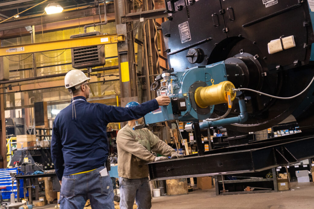 Finished commercial boiler being checked and finalized.